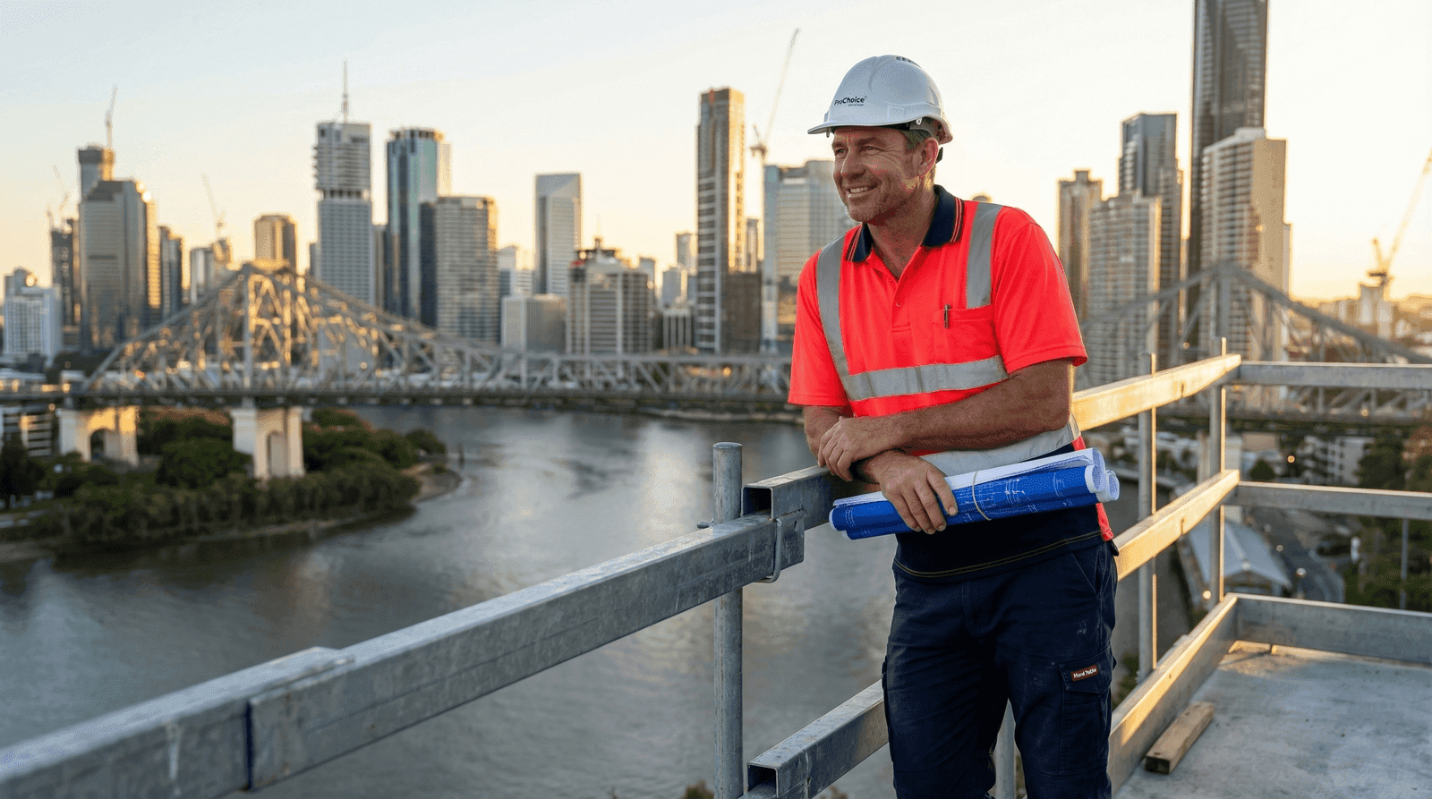 Confident Australian construction foreman overlooking Brisbane skyline at golden hour — foreman salary and career success in construction